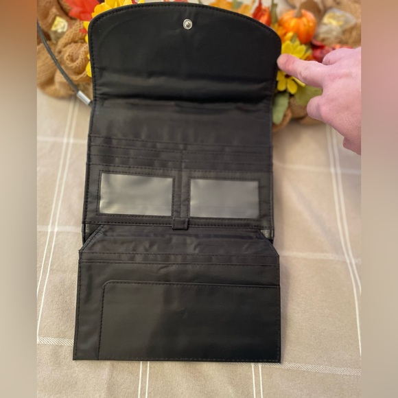 Medium Sized Black Crossbody with many options for storage. - Picture 7 of 12